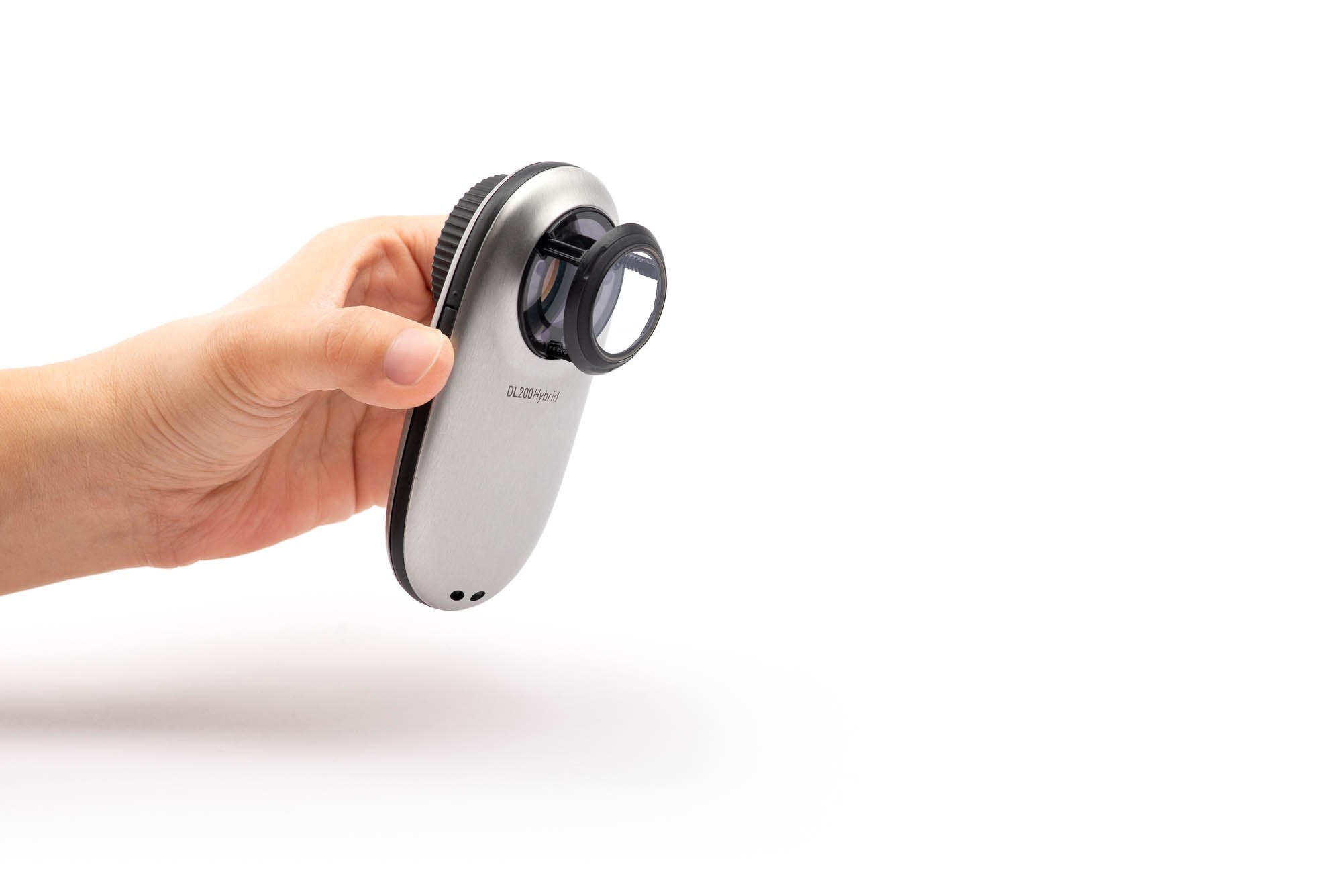 Hand holding DermLite DL200 Hybrid dermatoscope device.