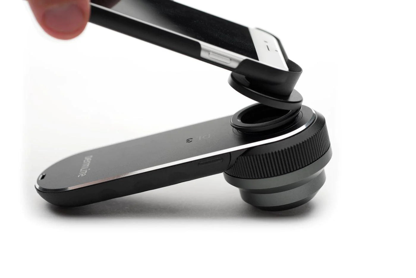 DermLite conenction kit used on an iPhone to connect to a DL3N laying on the table