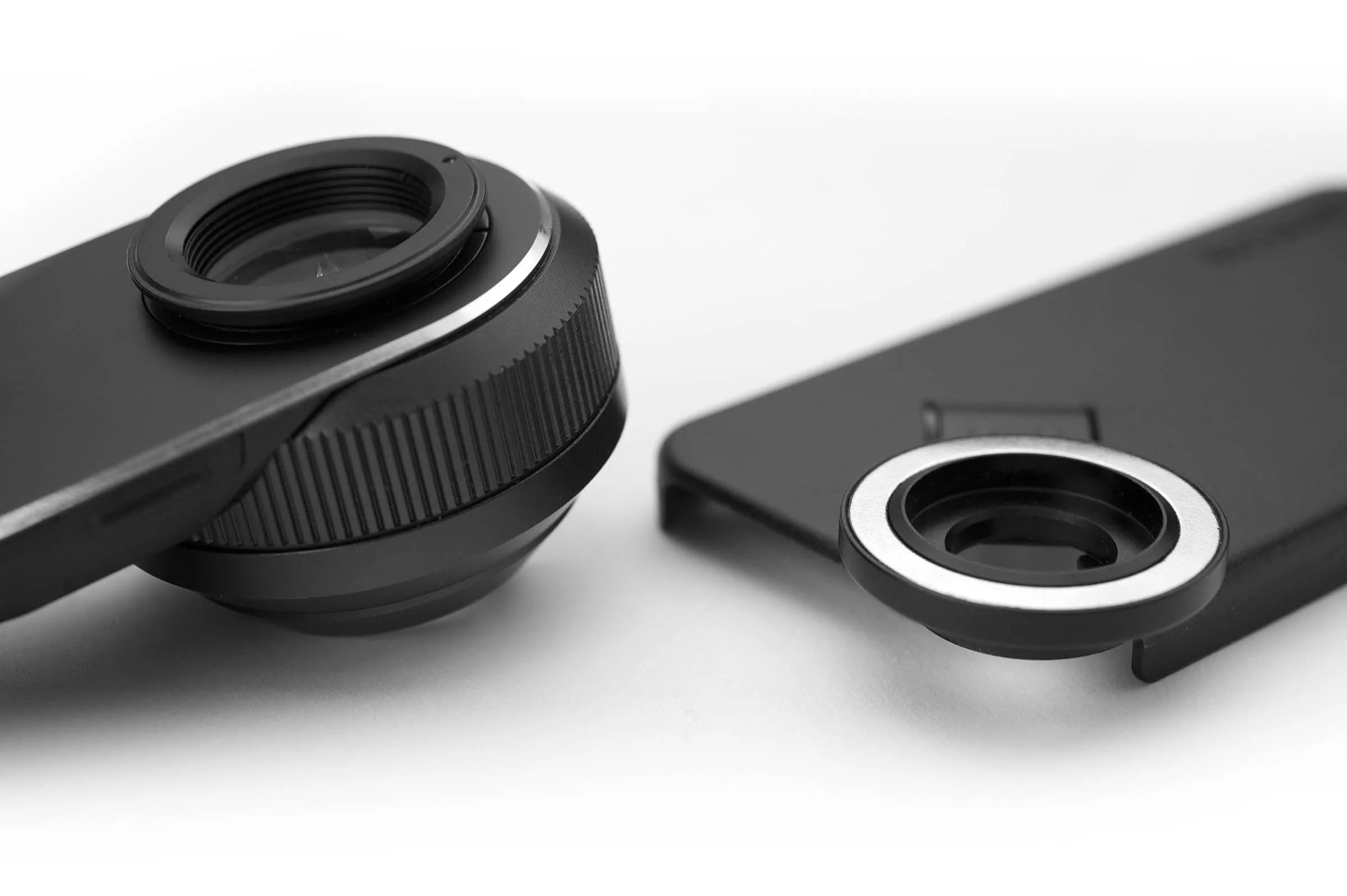 DL3N and DermLite connection kit placed side to side on table