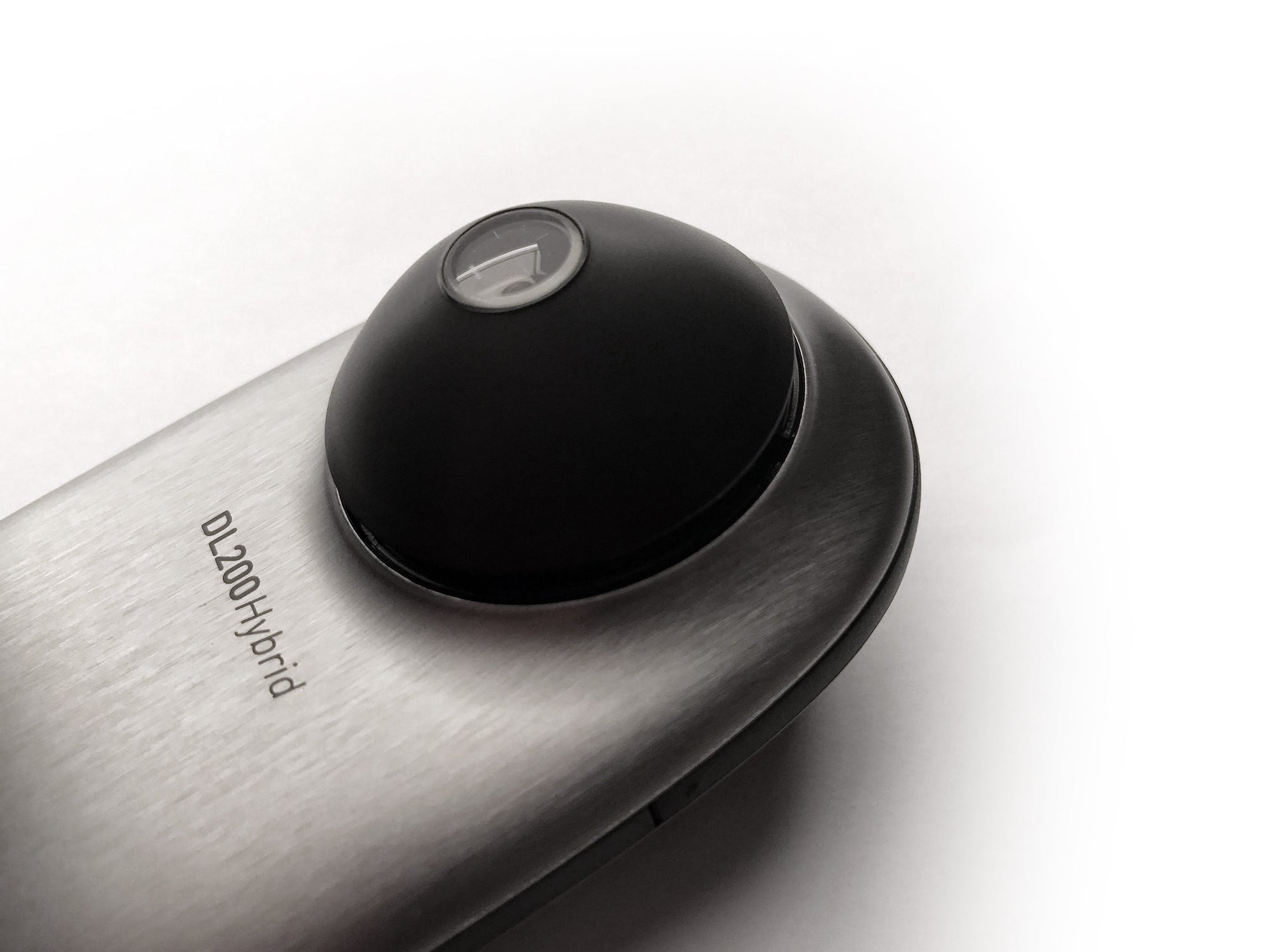 A small area contact plate attached to a DermLite DL200 Hybrid dermatoscope.