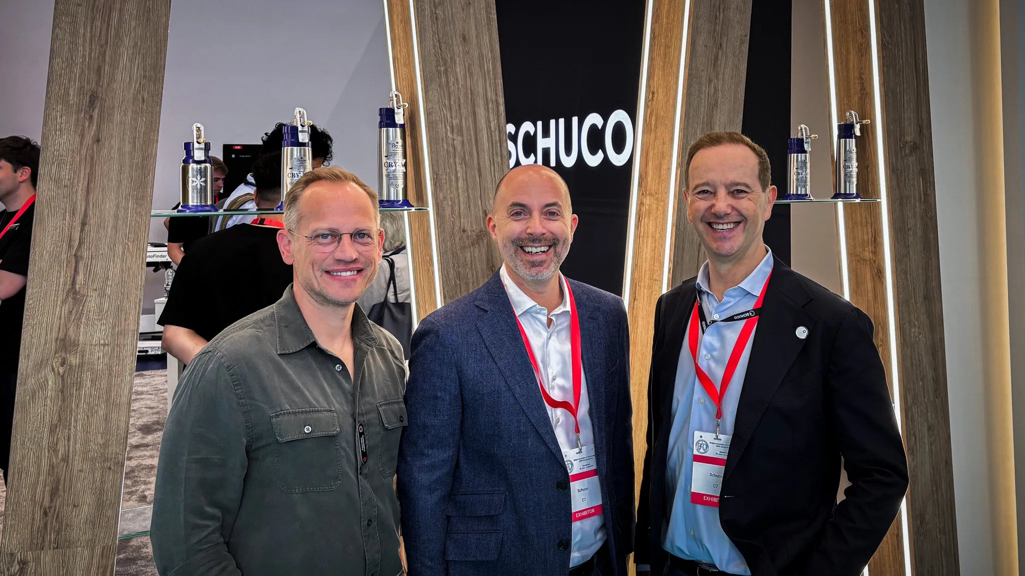 Thorsten Trotzenberg (FotoFinder x DermLite CTO), Peter Kinhan (FotoFinder x DermLite CCO), Paul Huttrer (Schuco Chairman) standing together at BAD 2026.