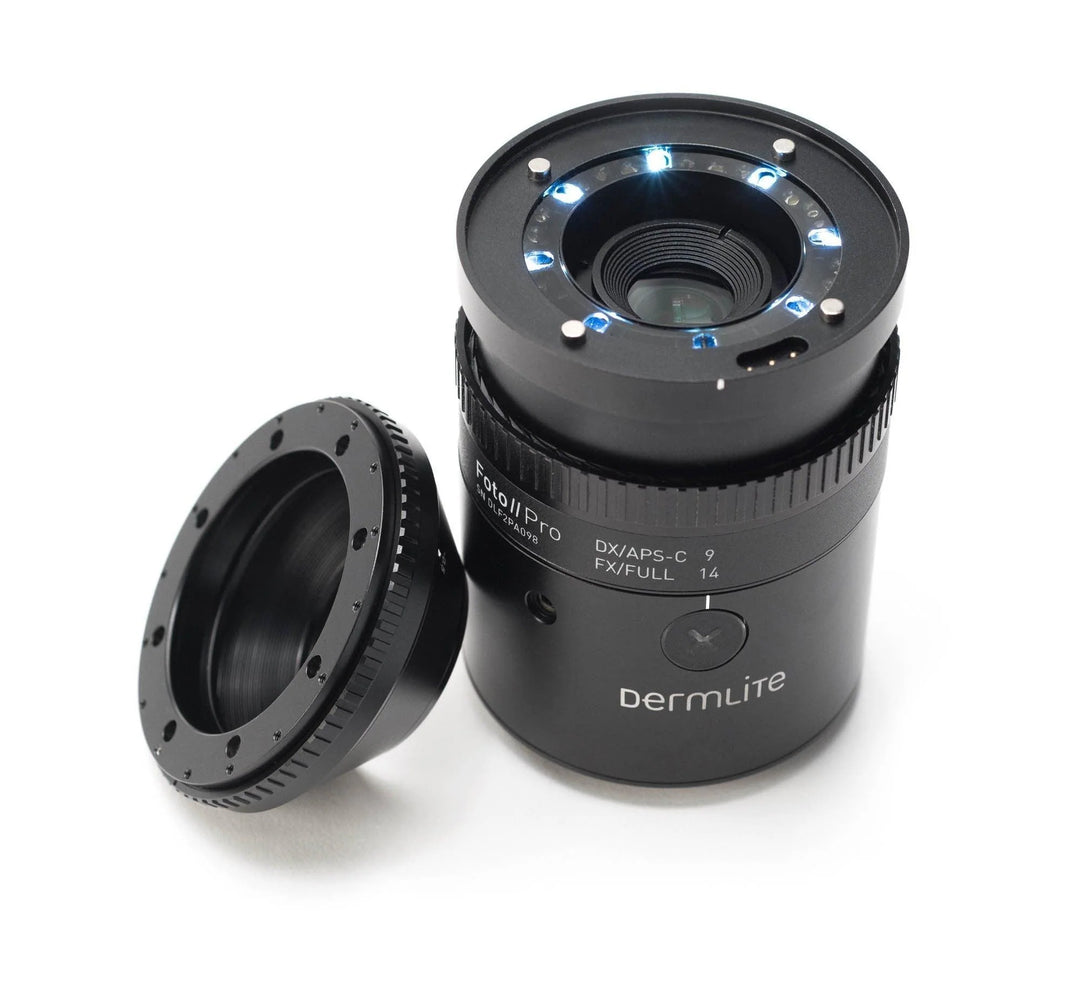 A black Bermire camera lens with its threaded cap removed and placed beside it on a clean white background. The lens has visible blue LED light indicators around the lens mount.