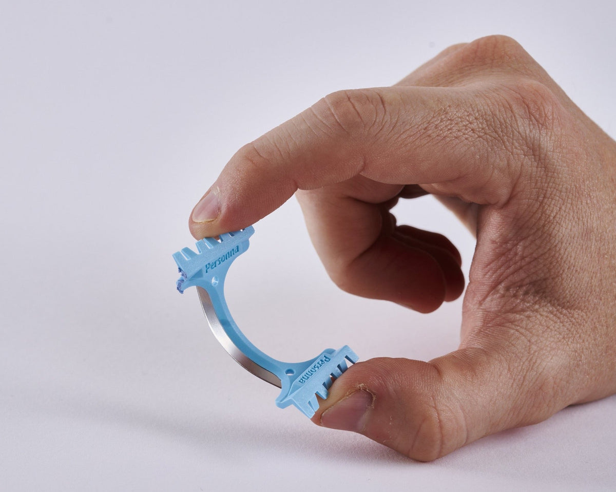 Hand holding DermaBlade