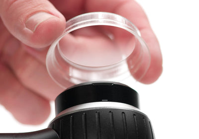 An IceCap being place on a DermLite DL4 dermatoscope.