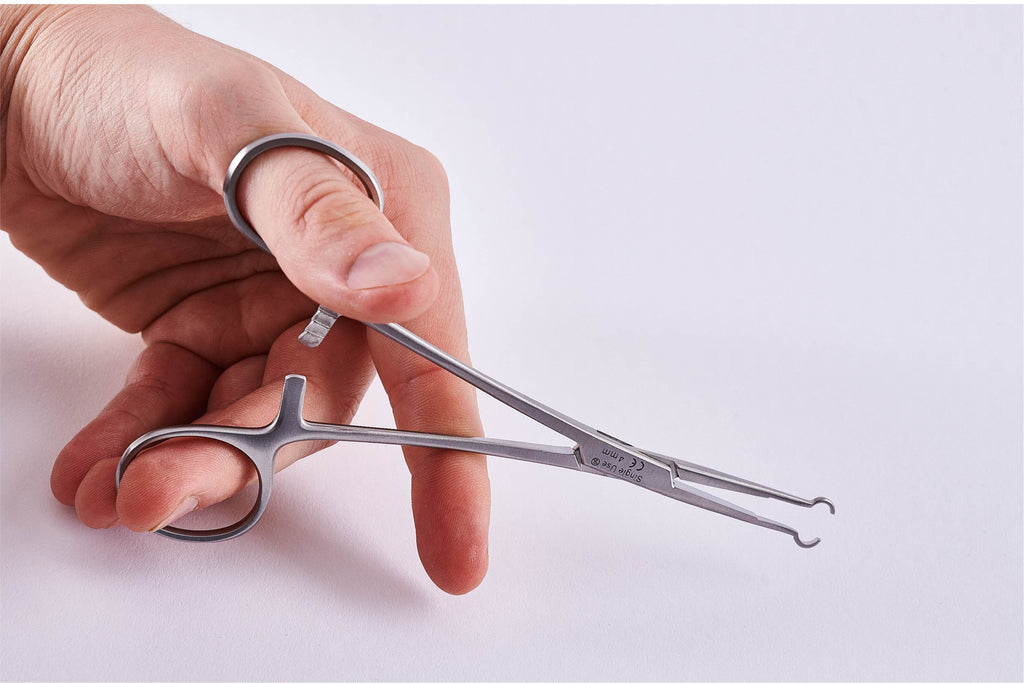 Non-scalpel vasectomy ringed forceps being used